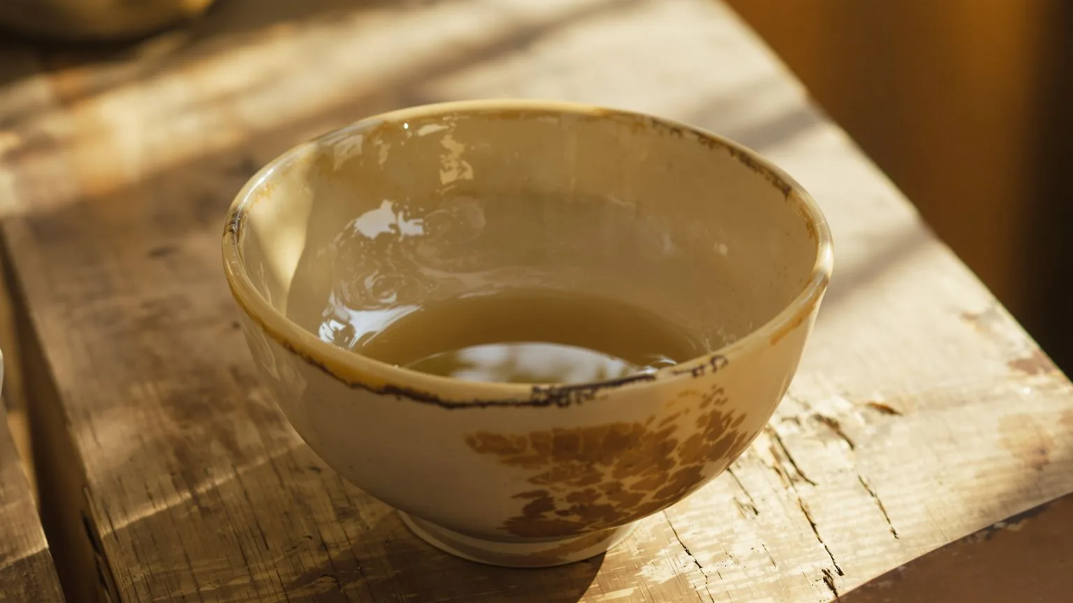 Handmade ceramic bowl in morning light symbolizing what changes after seven days of body practice