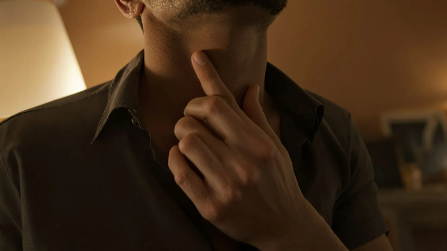 Close-up of hand near throat and neck during the 90-second body test for ego versus intuition