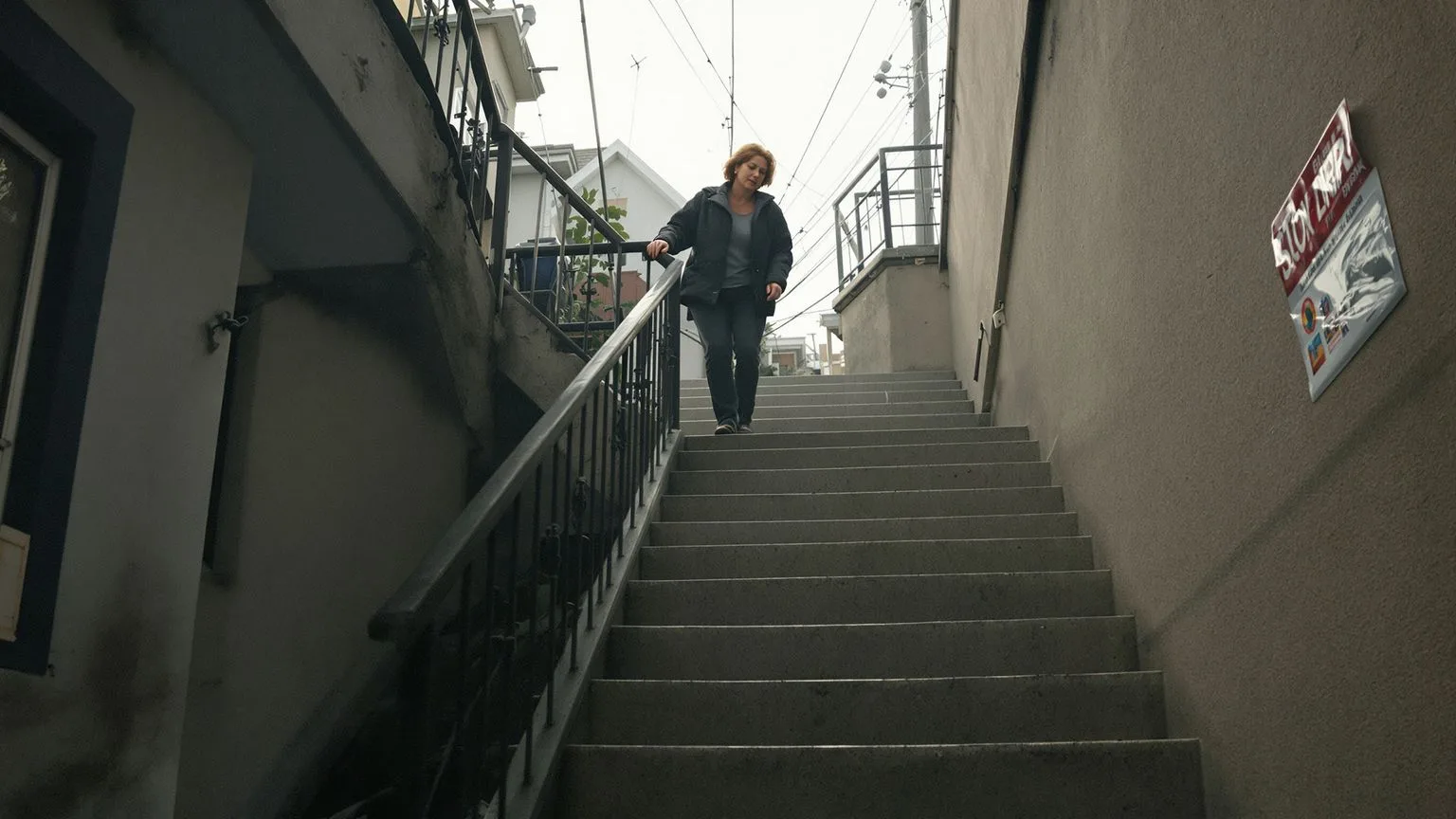 Woman ascending outdoor stairs at dawn with open posture illustrating why saying I'm fine can hurt more than silence