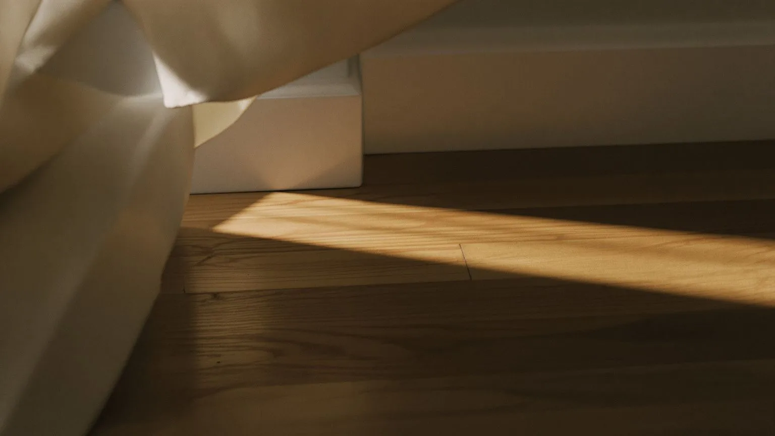 Weathered wooden floor detail showing quiet space for understanding difference between ego and higher self