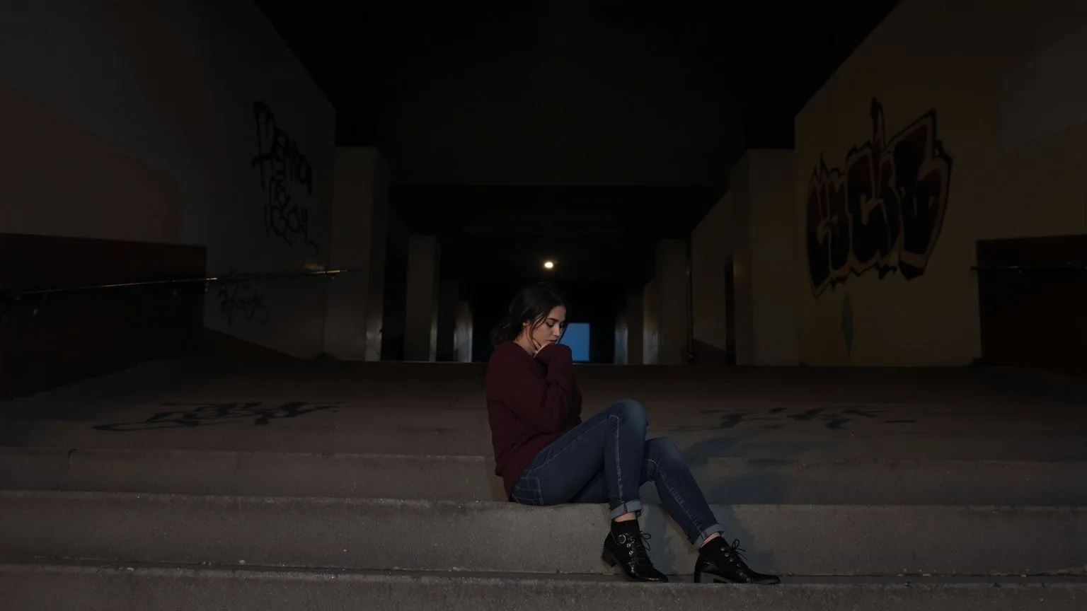 Man standing on wooden footbridge over misty river looking ahead, evoking why do I feel empty