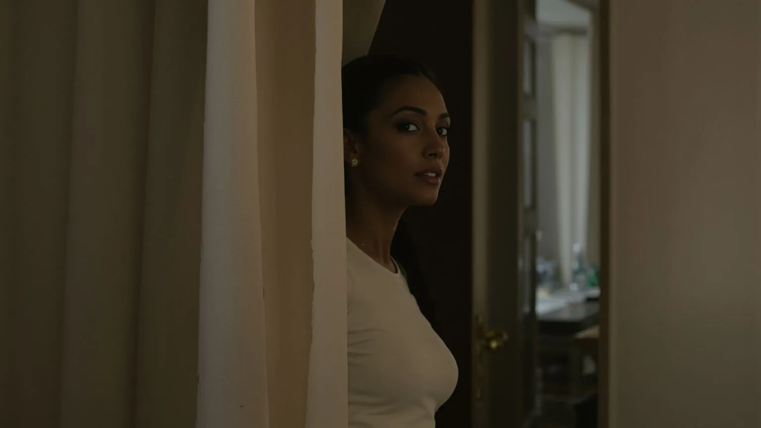 Woman stepping through a linen curtain into light with visible throat tension showing where overthinking lives in the body